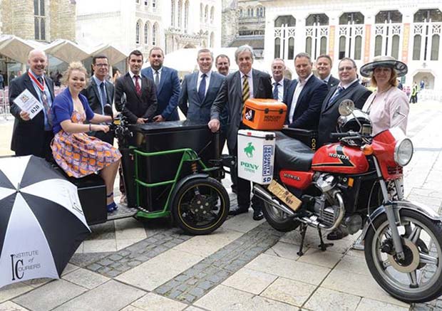 IOC fellows with entries old and new. Four decades separated the classic Honda CX eighties courier bike alongside a Gnewt zero emission electric trike registered with DVLA for commercial final mile delivery in the City.